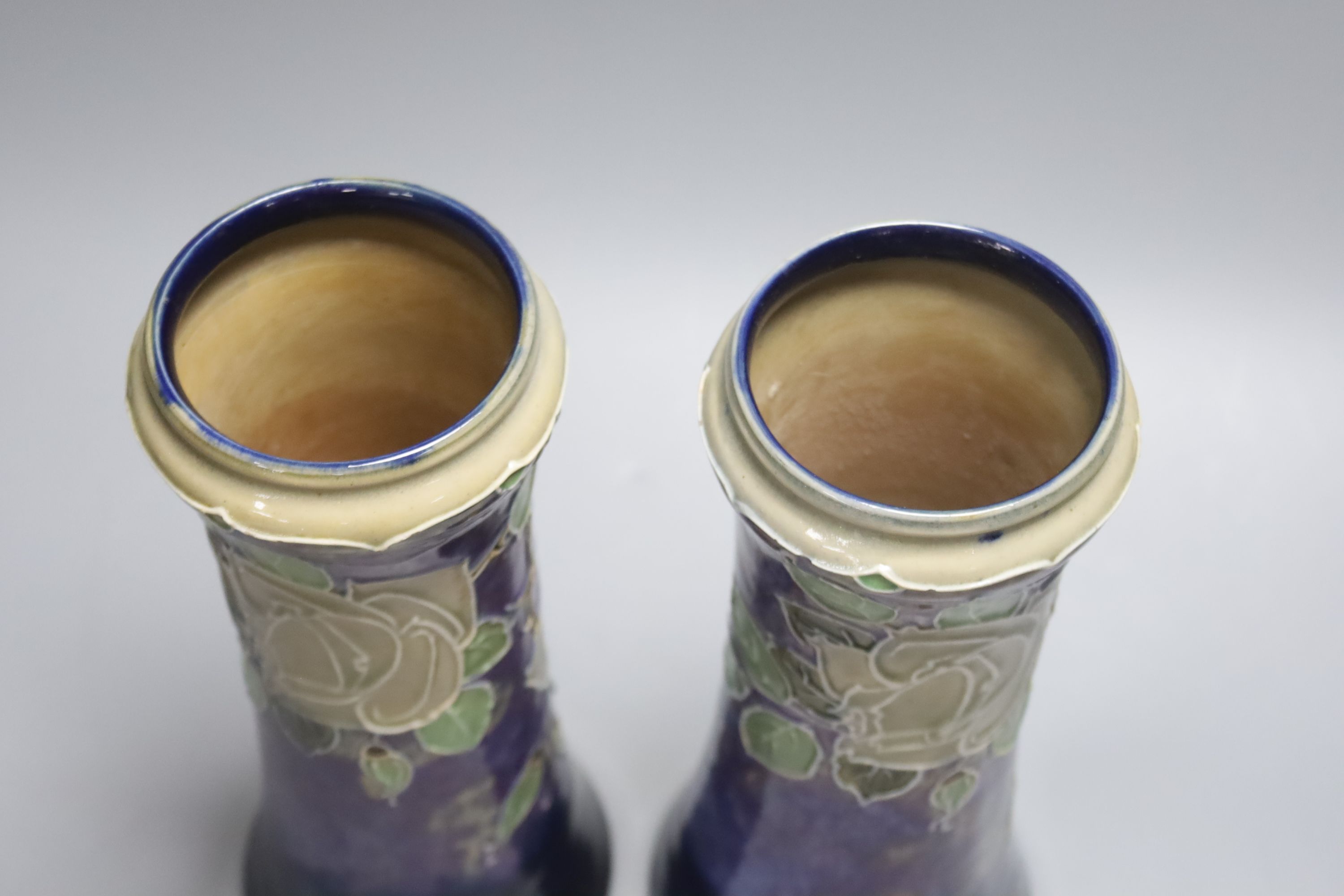 A pair of Doulton stoneware vases, height 26.5cm